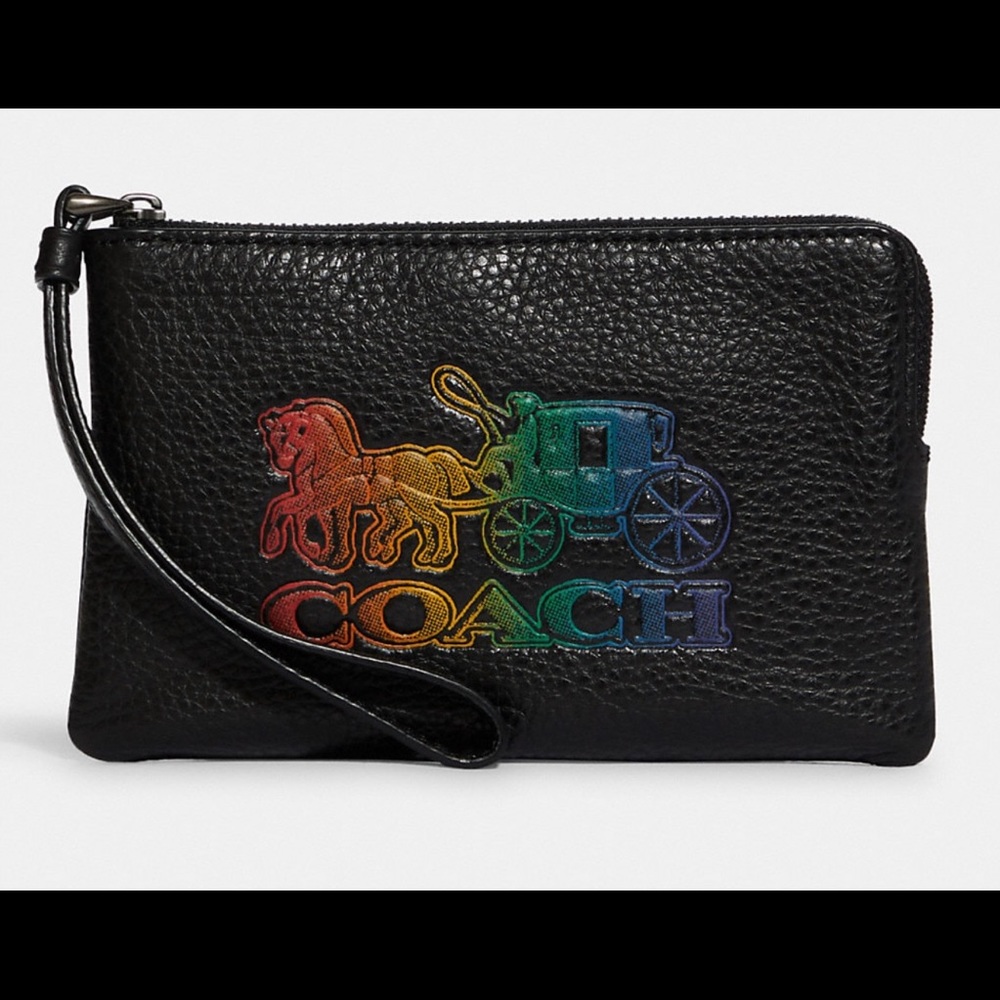 COACH wristlet 
Zip-top closure, fabric lining

6 1/4" (L) x 4" (H) x 1/2" (W